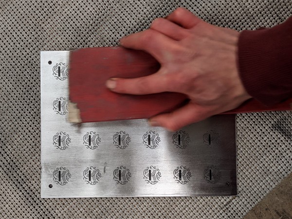 hand sanding the aluminum to a shiny finish